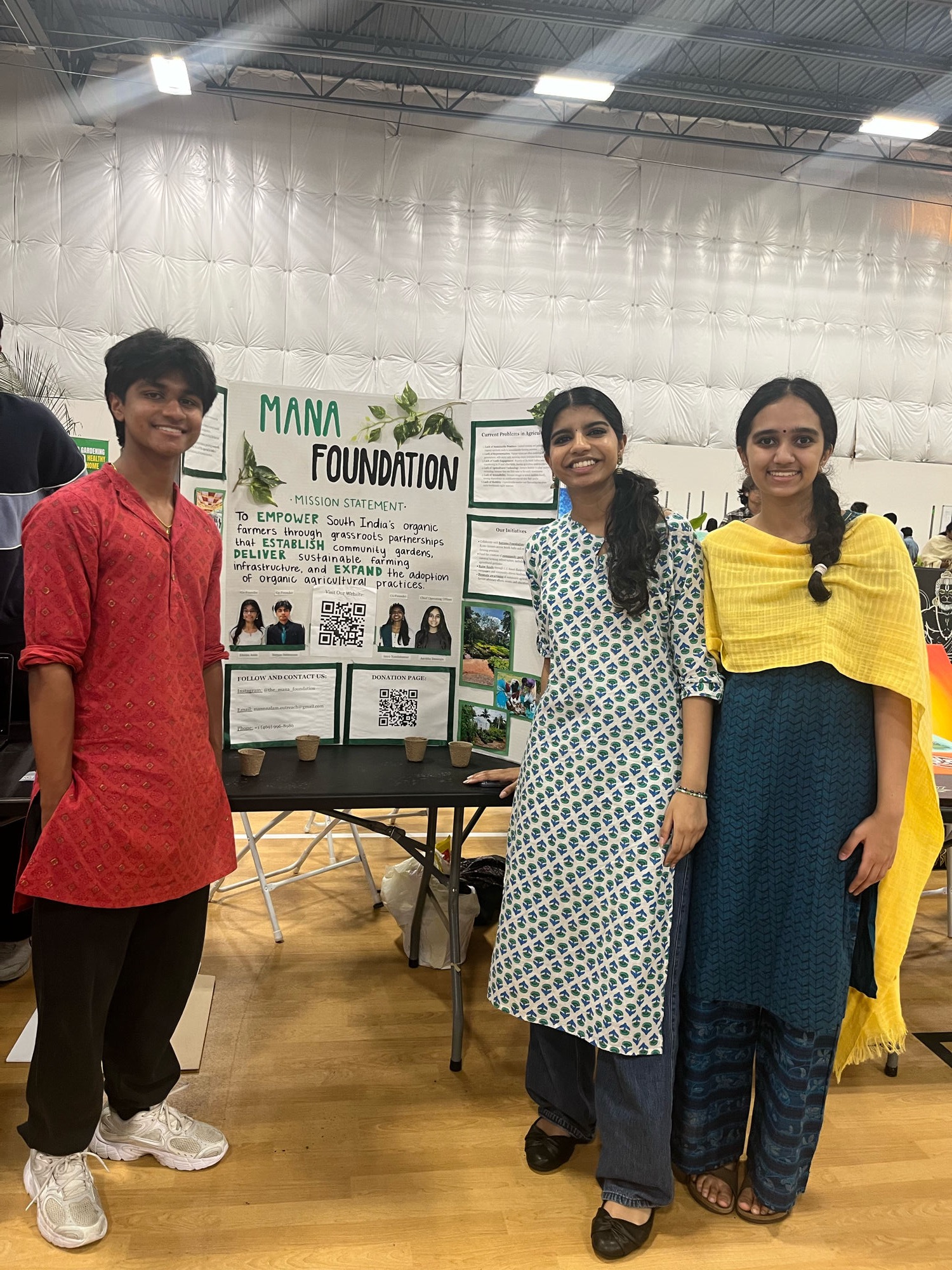 Mann Nalam youth volunteers at a community outreach event